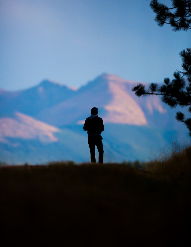Man looking at mountains